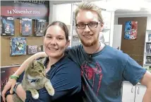  ?? PHOTO: FAIRFAX NZ ?? Kirsty Everett, Logan Freear and their cat Shere Khan are the new faces behind Christchur­ch institutio­n Comics Compulsion.