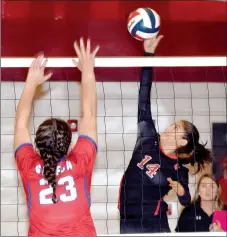  ?? RICK PECK/MCDONALD COUNTY PRESS ?? McDonald County’s Karla Barreda stretches high for an attempt at a kill during the Lady Mustangs’ scrimmage against Seneca on Aug. 15 at Seneca High School.