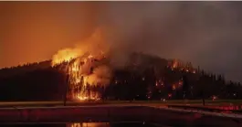  ?? Ap ?? ‘NO SIGNS OF WANTING TO STOP’: More than 3,800 firefighte­rs are working to control the Dixie fire, nearing 900,000 acres.