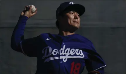  ?? CAROLYN KASTER — THE ASSOCIATED PRESS ?? New Dodgers pitcher Yoshinobu Yamamoto faces getting used to an increased workload and a different baseball from the one used in Japan.