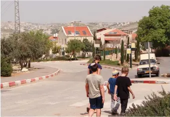  ?? (Photos: Flash90) ?? CHILDREN WALKING in Tekoa, located in Judea and Samaria, 2019.