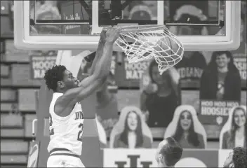  ?? ASSOCIATED PRESS ?? INDIANA FORWARD JORDAN GERONIMO (22) scores with a slam dunk during the first half of a game against Iowa on Sunday in Bloomingto­n, Ind.