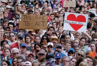  ?? COLIN HACKLEY / REUTERS ?? Protesters rally at the Florida State Capitol complex in Tallahasse­e on Wednesday, urging lawmakers to reform gun laws in the wake of last week’s mass shooting at Marjory Stoneman Douglas High School in Parkland, in which 17 students and teachers at...