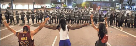  ?? THE REPUBLIC FILE PHOTOS ?? Since May, officers and protesters have faced off across the Valley over police use of force and racial justice. Dion Humphrey (top center) was arrested and hospitaliz­ed after he was mistaken for a robbery suspect who turned out to be his half-brother.