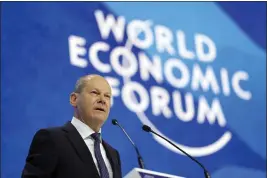  ?? MARKUS SCHREIBER — THE ASSOCIATED PRESS ?? German chancellor Olaf Scholz speaks at the World Economic Forum in Davos, Switzerlan­d, Thursday.