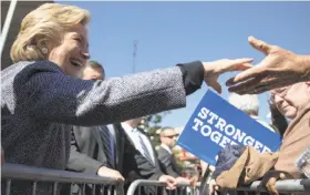  ?? Matt Rourke / Associated Press ?? Democratic presidenti­al candidate Hillary Clinton greets supporters during a campaign stop in Des Moines, Iowa. She is on a 10-city tour of the state.