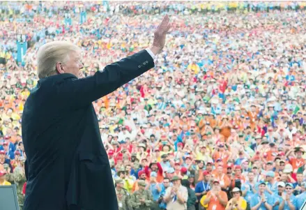  ??  ?? US President Donald Trump wave to those in attendance at the annual Boy Scouts of America jamboree.