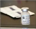  ?? MARK LENNIHAN — THE ASSOCIATED PRESS ?? A vial of the Moderna coronaviru­s vaccine is displayed at a clinic organized by New York City’s Department of Health on Monday.