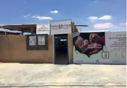  ?? — Supplied photos ?? A clinic at the Zaatari camp advertises the importance of inoculatin­g children on its outer walls.