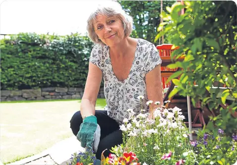  ??  ?? n
Loraine Furness enjoys gardening and says it helps to get her through her illness.