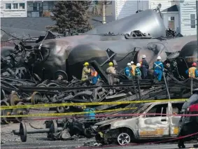  ?? POOL-RYAN REMIORZ/THE Canadian Press ?? Work continues at the crash site of the train derailment and fire in Lac-Megantic, Que.