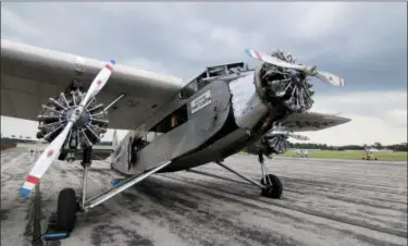  ?? JONATHAN TRESSLER — THE NEWS-HERALD ?? A view of this Liberty Ford 5-AT-B Tri-Motor aircraft’s namesake engines as the plane stands by at Lost Nation Airport in Willoughby Aug. 10.