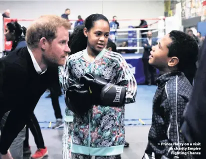  ??  ?? > Prince Harry on a visit to charity Empire Fighting Chance