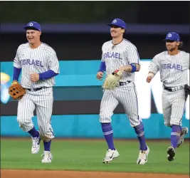 ?? MEGAN BRIGGS — GETTY IMAGES ?? Joc Pederson (23), Jakob Goldfarb (8) and Noah Mendlinger (6) of Team Israel celebrate after defeating Team Nicaragua in a World Baseball Classic Pool D game at loanDepot park on Monday in Miami.