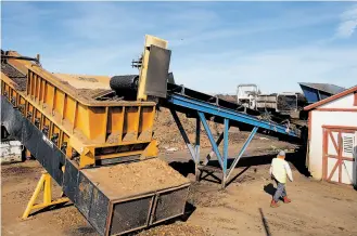  ??  ?? Clockwise from top left: Fidel Osuna walks near a machine that separates larger items and nonorganic materials at a Jepson Prairie Organics compost facility near Vacaville. John Wick climbs into his tractor to distribute compost on his ranch. UC...