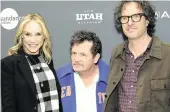  ?? CHRIS PIZZELLO Chris Pizzello/Invision/AP ?? Michael J. Fox, center, the subject of ‘Still: A Michael J. Fox Movie,’ poses with his wife Tracy Pollan, left, and director Davis Guggenheim at the premiere of the documentar­y film at the 2023 Sundance Film Festival.