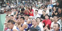  ?? ?? Left: Players listen intently to their coach during a basketball game in Taijiang county, Guizhou province on Aug 1.