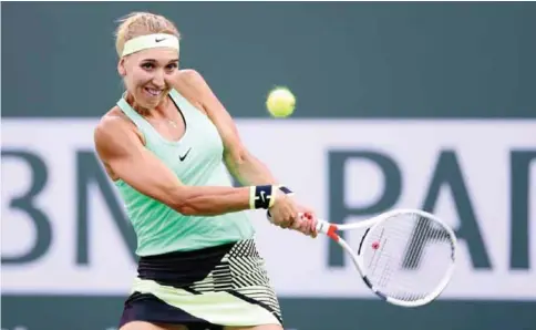  ??  ?? INDIAN WELLS: Elena Vesnina of Russia returns a shot to Venus Williams during the BNP Paribas Open at the Indian Wells Tennis Garden. — AFP