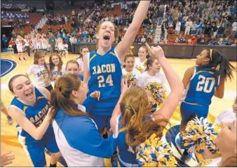  ?? TIM COOK/THE DAY ?? Bacon Academy’s Sarah Rogers (24) had six points in the Bobcats’ 12-0 run to end the Class L state championsh­ip on Saturday at Mohegan Sun Arena. Rogers had nine points, 14 rebounds and held E.O. Smith center Morgan Olander, the Panthers’ leading...