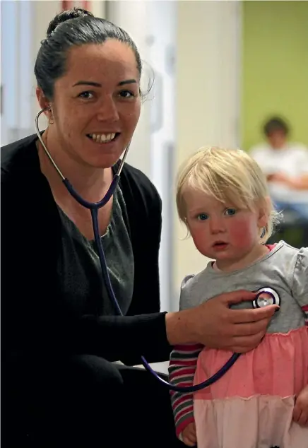  ?? LUKE KIRKEBY/ FAIRFAX NZ ?? Young Nurse of the Year winner Rosita Richards with patient 14-month-old Sofia Steiner.