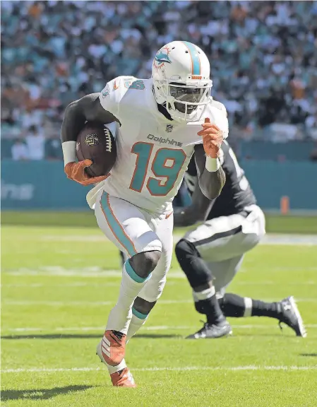  ?? KIRBY LEE/USA TODAY SPORTS ?? The Dolphins and Jakeem Grant, who had two receptions for two TDs against the Raiders, are 3-0.