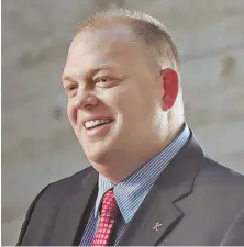  ?? STAFF PHOTOS BY PATRICK WHITTEMORE ?? A NU ERA: Jeff Konya is all smiles during his introducto­ry press conference after being named the Northeaste­rn athletic director, earning a thumbs up from Huskies mascot Paws.