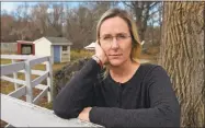  ?? / H. John Voorhees III ?? Scarlett Lewis stands in the yard of her Sandy Hook home. Lewis lost her son, Jesse Lewis, in the Sandy Hook School shooting.