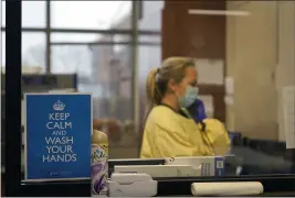  ?? JEFF ROBERSON — THE ASSOCIATED PRESS FILE ?? On Nov. 24, registered nurse Chrissie Burkhiser works in the emergency room at Scotland County Hospital in Memphis, Mo.