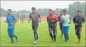  ?? HT PHOTO ?? Runners practicing in the MMM stadium on the eve of the Indira Marathon in Prayagraj on Thursday.