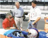  ?? MICHAEL CONROY/AP ?? Marco Andretti, bottom, talks to his grandfathe­r and 1969 Indy 500 champion Mario Andretti, left, uncle Aldo Andretti, top center, and father Michael Andretti during a practice at Indianapol­is Motor Speedway in 2005.