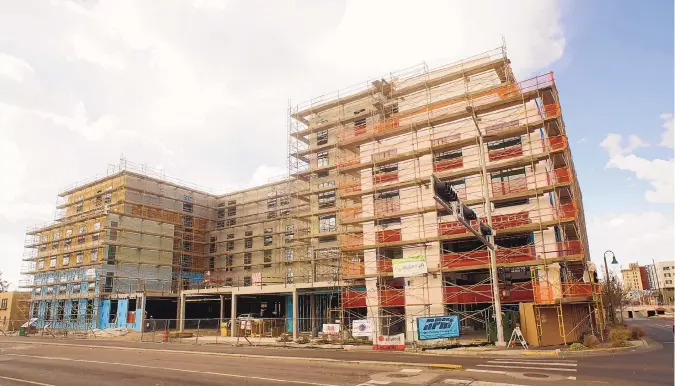  ?? ADOLPHE PIERRE-LOUIS/JOURNAL ?? One of Albuquerqu­e’s most visible commercial projects, a Hilton Garden Inn in East Downtown, is taking shape at the corner of Central Avenue and Broadway Boulevard.