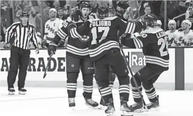  ?? RICH GAGNON/GETTY IMAGES ?? Derek Forbort and the Boston Bruins celebrate his goal during the third period of Game 6.