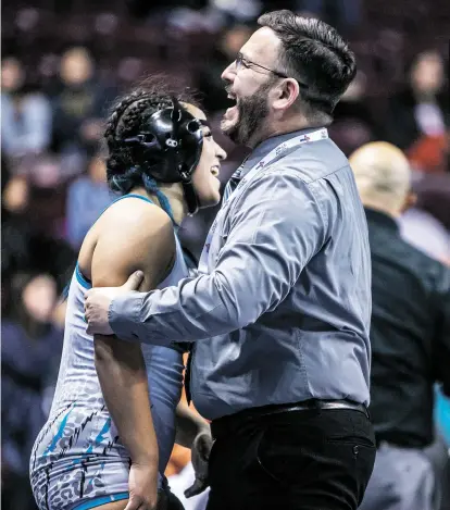  ?? NEW MEXICAN FILE PHOTO ?? LEFT: Anika Rodriguez of Capital hugs head coach Marcos Gallegos after winning third place in the 165-pound class at the state wrestling championsh­ips in February. The senior won 30 of her 35 matches and came closer to beating champ Bre Samora of Albuquerqu­e Manzano than anyone else.