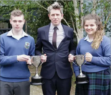  ??  ?? Year head Donal Evoy presents the third year Rogha na Bliana to Alan O’Callaghan and Aine Molloy.