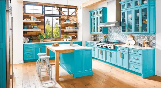  ?? COURTESY PHOTO ?? Painted kitchen cabinets now make up 70 percent of the market, giving homeowners an endless palette and bold color options.