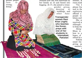  ??  ?? Transgende­r woman Rani Khan (right) who teaches the Koran, prays with one of her students in Islamabad, Pakistan