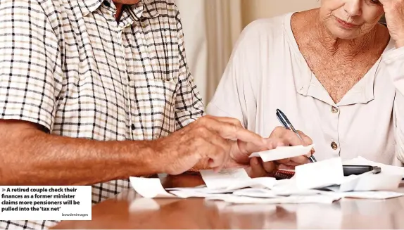  ?? Bowdenimag­es ?? > A retired couple check their finances as a former minister claims more pensioners will be pulled into the ‘tax net’
