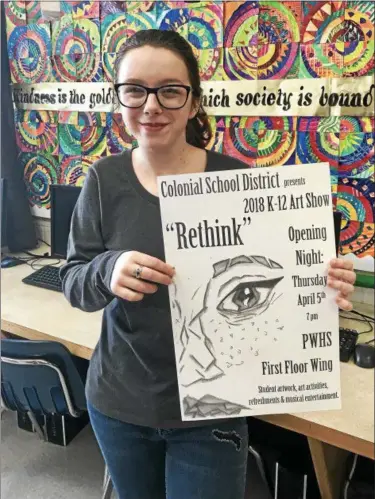  ?? SUBMITTED PHOTO ?? Tess Wosczyna, an eighth-grader at Colonial Middle School, holds the poster she designed for the 2018 Colonial School District art show.