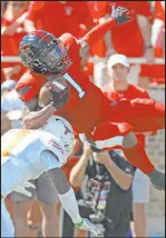  ?? The Associated Press ?? Brad Tollefson
Texas safety Anthony Cook hits Texas Tech wide receiver Myles Price during the Red Raiders’ 3734 overtime victory Saturday.