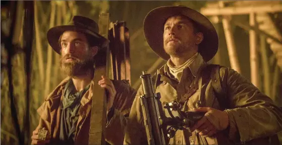  ?? AIDAN MONAGHAN, AMAZON STUDIOS & BLEECKER STREET ?? Robert Pattinson as Henry Costin and Charlie Hunnam as Percy Fawcett in “The Lost City of Z.”