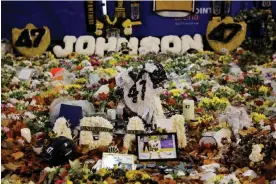  ?? Photograph: Tom Jenkins/The Guardian ?? Floral tributes placed outside the Motorpoint Arena in Nottingham in memory of Adam Johnson, the Nottingham Panthers ice hockey player who was killed in an accident during a match last month.