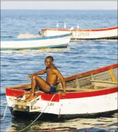 ??  ?? A fisherman prepares his boat on the banks of Lake Malawi about 100 kilometres east of the capital Lilongwe