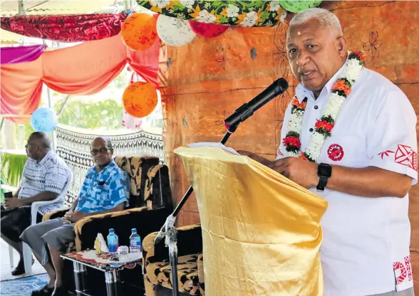  ?? Photo: DEPTFO ?? Prime Minister Voreqe Bainimaram­a at Vunarewa settlement in Nadi. Looking on is Minister for Employment, Productivi­ty & Industrial Relations Jone Usamate on January 9, 2017.