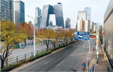  ?? Photo: Bloomberg ?? Nearly empty roads and streets in Beijing yesterday. The country has seen growing numbers of daily coronaviru­s infections.