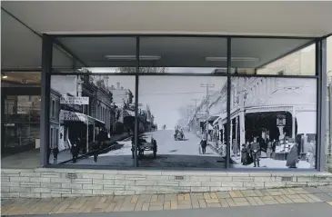  ?? ?? Images put up in the front windows of the building this week depict the same section of Stafford St in the early 1900s.