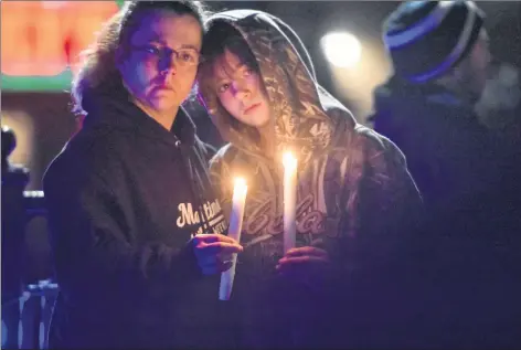  ?? TINA COMEAU ?? The heartbreak was evident as people attended a candleligh­t vigil held in Yarmouth on Nov. 26.