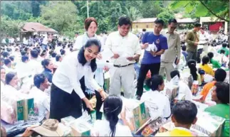  ?? SUPPLIED ?? Supplies are handed out to victims of flooding in Koh Kong province on Tuesday.