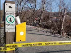  ?? Special to Okanagan Newspaper Group ?? Penticton RCMP officers investigat­e the scene of an explosion near Carmi Elementary School in March. It was one of at least three locations where pipe bombs were exploded over a period of two days.