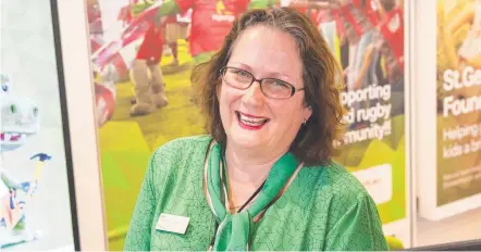  ?? Picture: Kevin Farmer ?? MILESTONE: Customer Service Officer Ellen Rostad was all smiles as she celebrated her 30th year of working at the Toowoomba branch of the St George Bank.