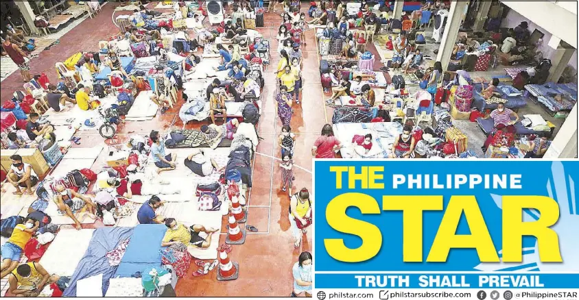  ?? RUSSELL PALMA ?? About 180 locally stranded individual­s take shelter in a multi-purpose hall of the Philippine Ports Authority in Manila after their ferry trips for the Visayas were cancelled.